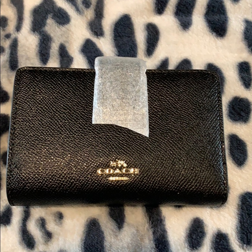 Brand new small Coach wallet with tag.